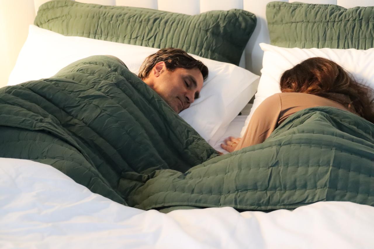 Couple sleeping comfortably on Perfectly Snug Smart Topper